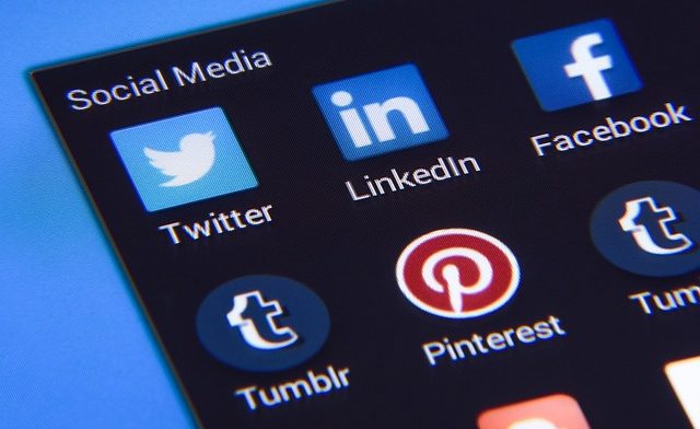 Computer screen with various social media application icons visible