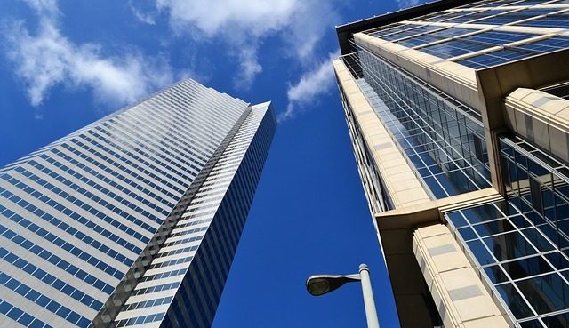 Skyscrapers viewed from below with blue sky in background