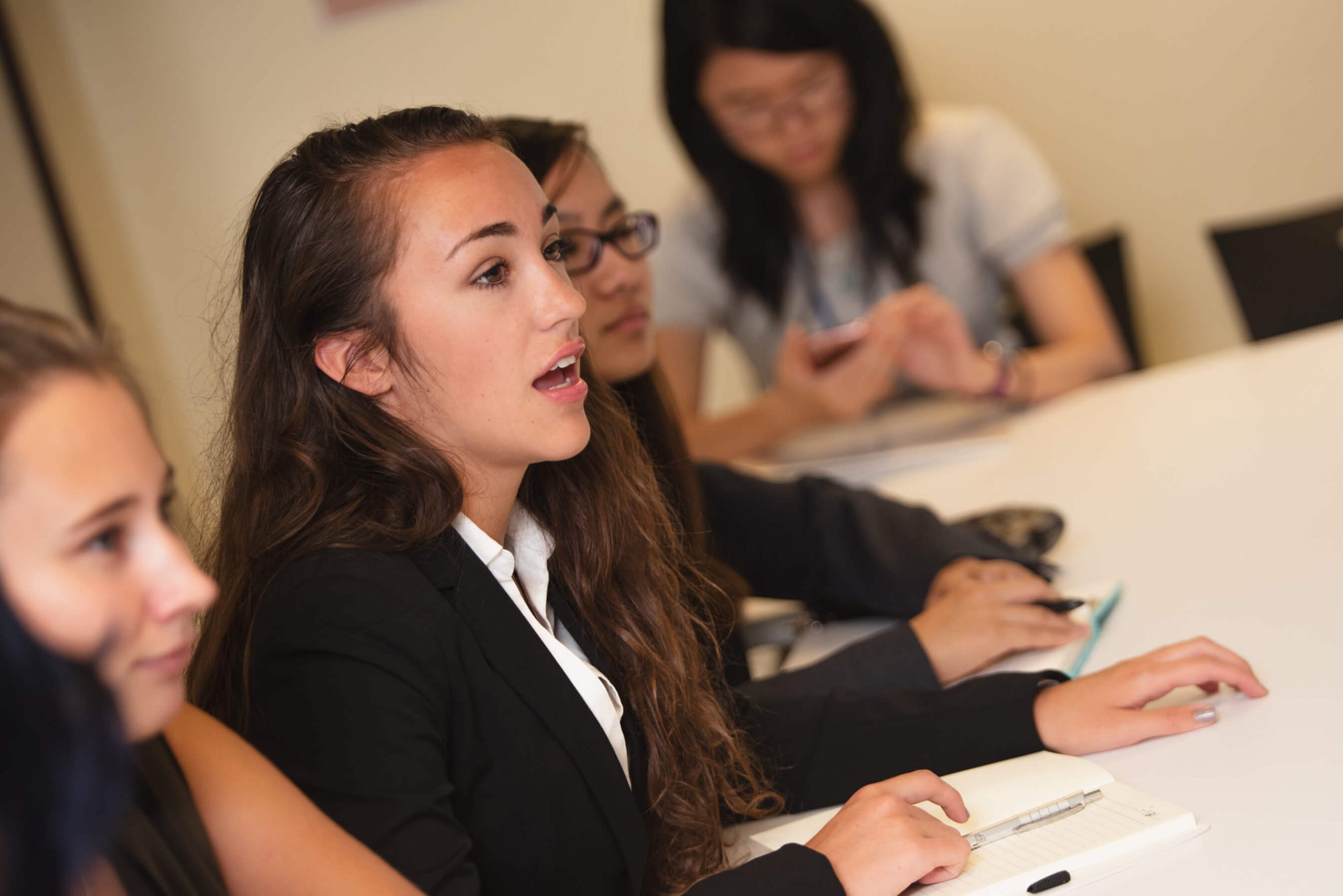 Two students sitting at lecture. 